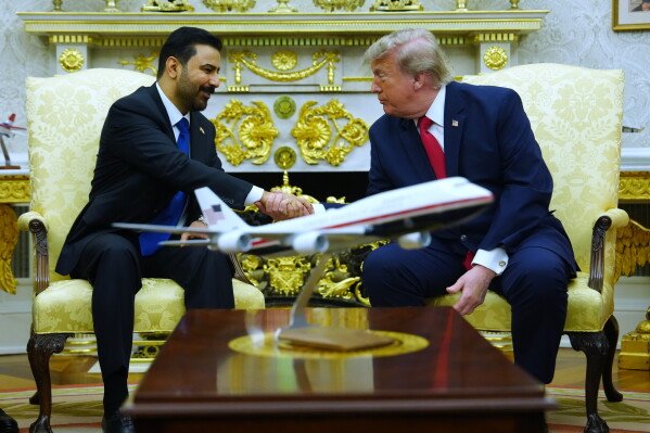 Iraqi PM al-Zaidi and US president Trump shaking hands