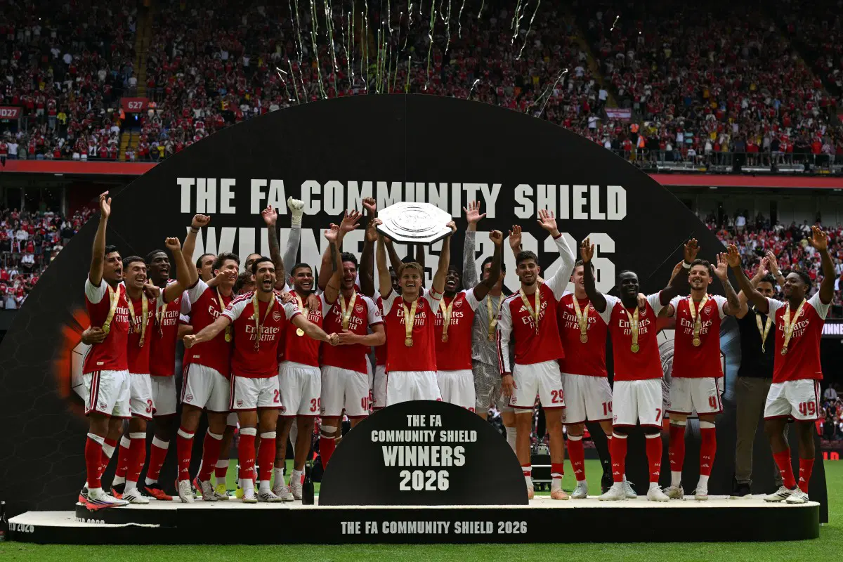Arsenal’s Norwegian midfielder #08 Martin Odegaard lifts the trophy as Arsenal’s players celebrate their victory after the English FA Community Shield football match between Arsenal and Manchester City at The Principality Stadium, in Cardiff, south Wales on August 16, 2026. Arsenal won the game 3-0. (Photo by Glyn KIRK / AFP)